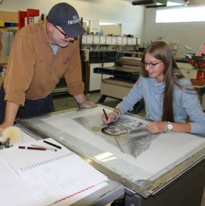 Amy Hanfstingl working with professor Briar Craig in the printmaking studio