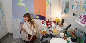 Aiden working in her studio on campus during her BFA