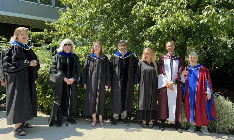 FCCS faculty members waiting for the procession of students 